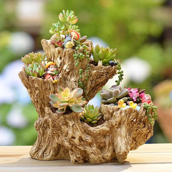 Pot de fleurs en résine en forme d'arbre pour plantes succulentes sur un bureau