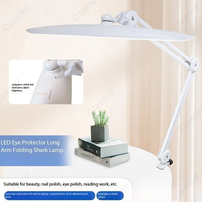 Lampe de chevet pince LED pliante en noir sur table de bureau