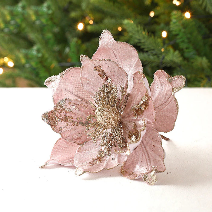 Fleur de Noël à paillettes dorées sur fond blanc
