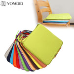 Coussin de jardin 50x50 cm uni jaune sur chaise en rotin