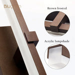 Détail de l'applique murale en aluminium avec éclairage directionnel vers le bas