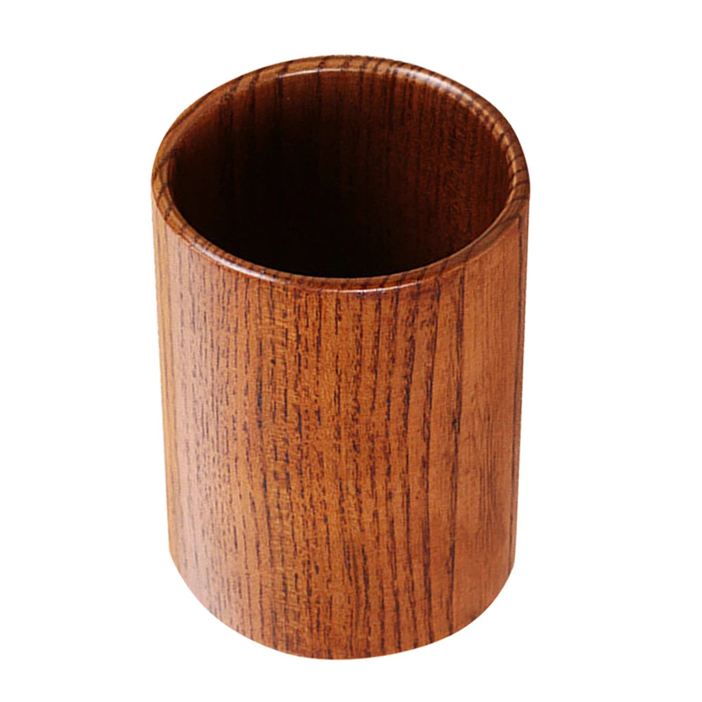 Pot de rangement rond en bois marron pour ustensiles de cuisine sur comptoir