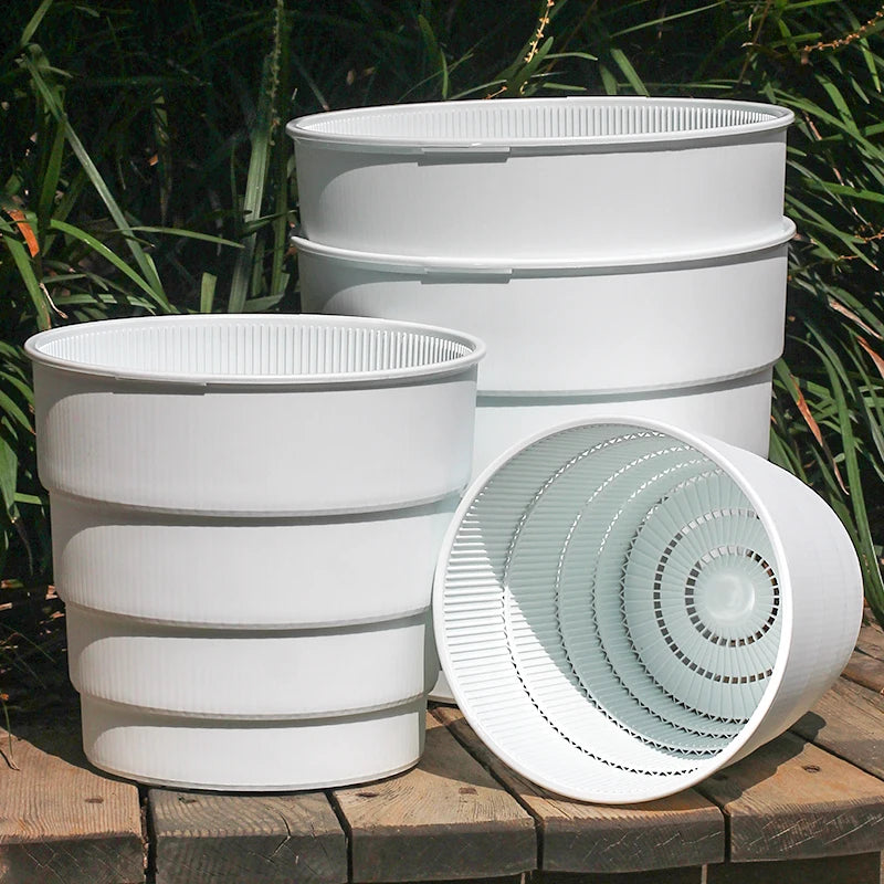 Cache-pot meshpot blanc avec trous d'air pour plantes intérieures