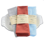 Serviettes de table en coton 100% de la marque Yanting dans différentes couleurs.