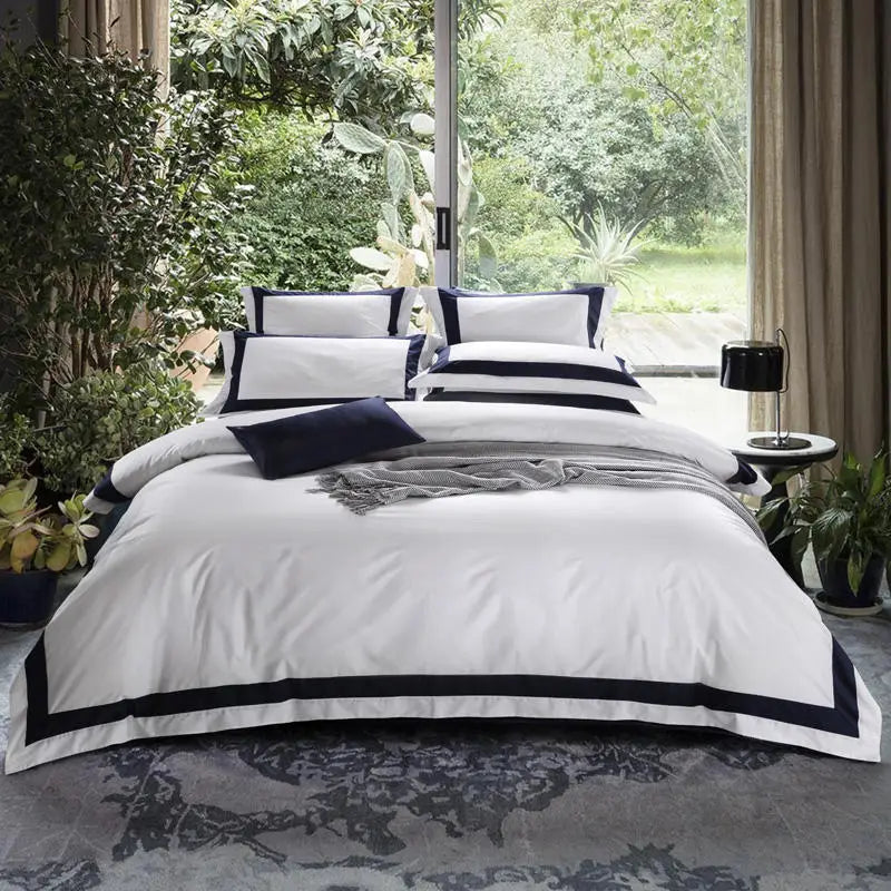 Parure de lit blanc 100% coton sur un lit queen avec oreillers