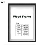 Cadre photo A3 en bois classique noir sur mur blanc