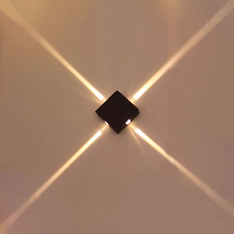 Détail de l'applique murale LED en fer et acrylique avec éclairage blanc chaud
