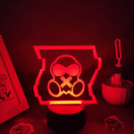 Lampe 3D masque à gaz LED RGB allumée en multicolore sur table nuit