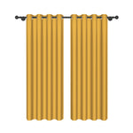 Paire de rideaux jaune moutarde au tombé élégant, conçus avec des œillets pour tringle, vue produit sur fond blanc.