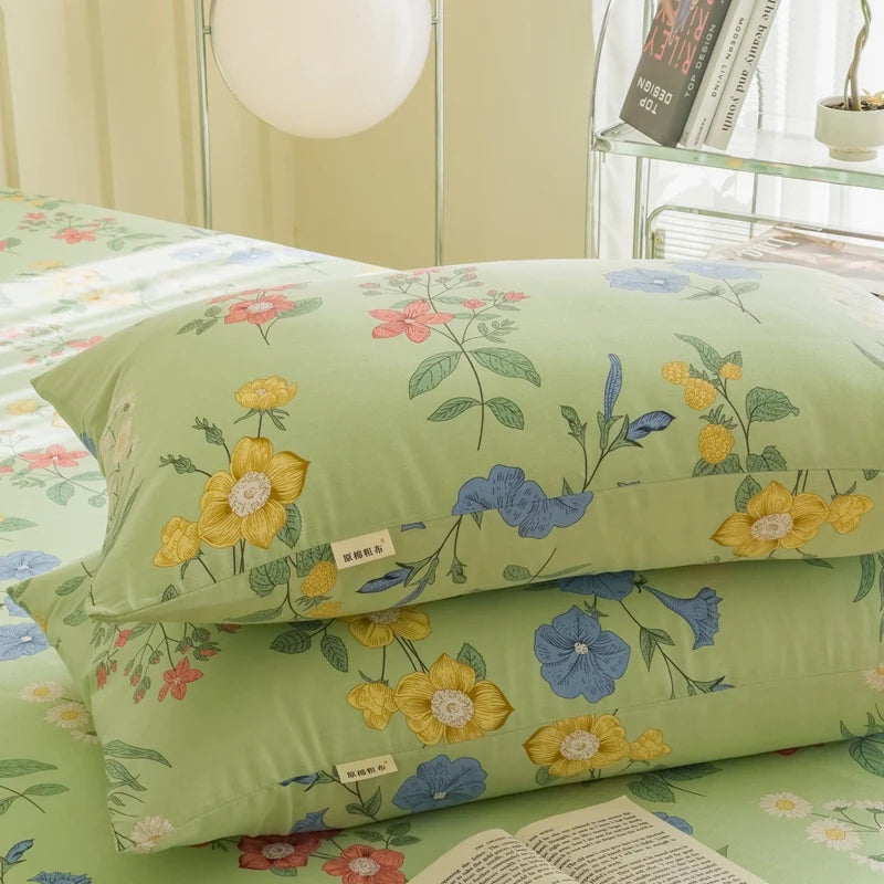 Un motif de fleurs colorées et stylisées sur un fond vert clair, créant une atmosphère de beauté et de sérénité.