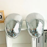 Boule disco fondue or sur table basse