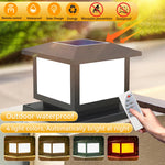 Lampe colonne solaire éclairant une allée de jardin la nuit