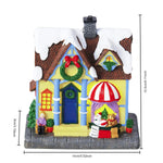 Maison de Noël allumée dans l'obscurité