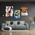 Intérieur contemporain élégant avec canapé gris, œuvres d'art murales abstraites et mobilier moderne.