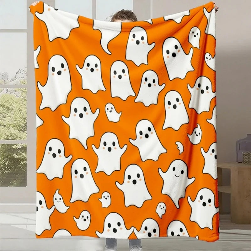 Une couverture fantaisiste et amusante arborant de nombreux fantômes souriants sur un fond orange vif.