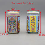 Deux pots de céramique colorés avec des motifs asiatiques, mesurant 13,5 cm de hauteur et 8 cm de diamètre.