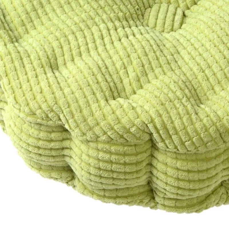 Détail du tissu tufté et du velours côtelé du coussin