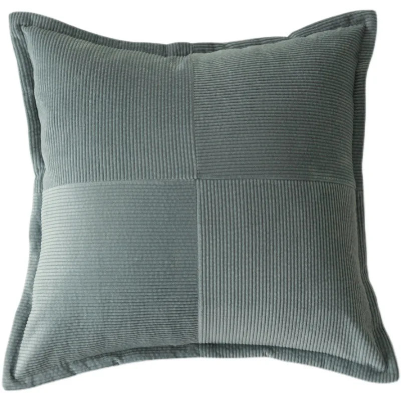 Coussin d'ameublement gris à motifs texturés, offrant une touche confortable et élégante à l'aménagement intérieur.