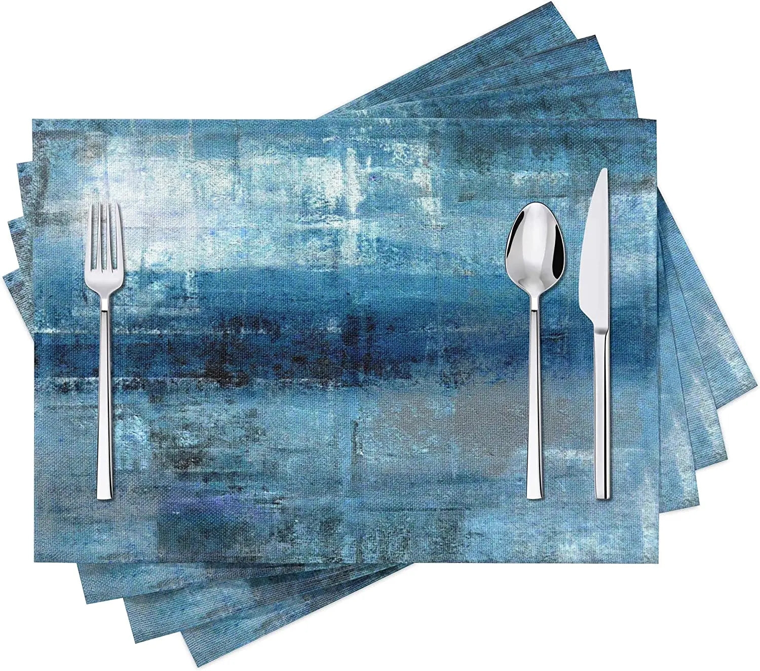 Set de 4 sets de table moderne avec motif abstrait bleu et gris sur une table à manger