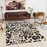 Tapis de sol abstrait avec des motifs de taches de couleurs variées, créant une ambiance moderne et élégante dans un salon d'intérieur.