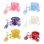 Jardinière tricycle vintage rose avec fleurs artificielles