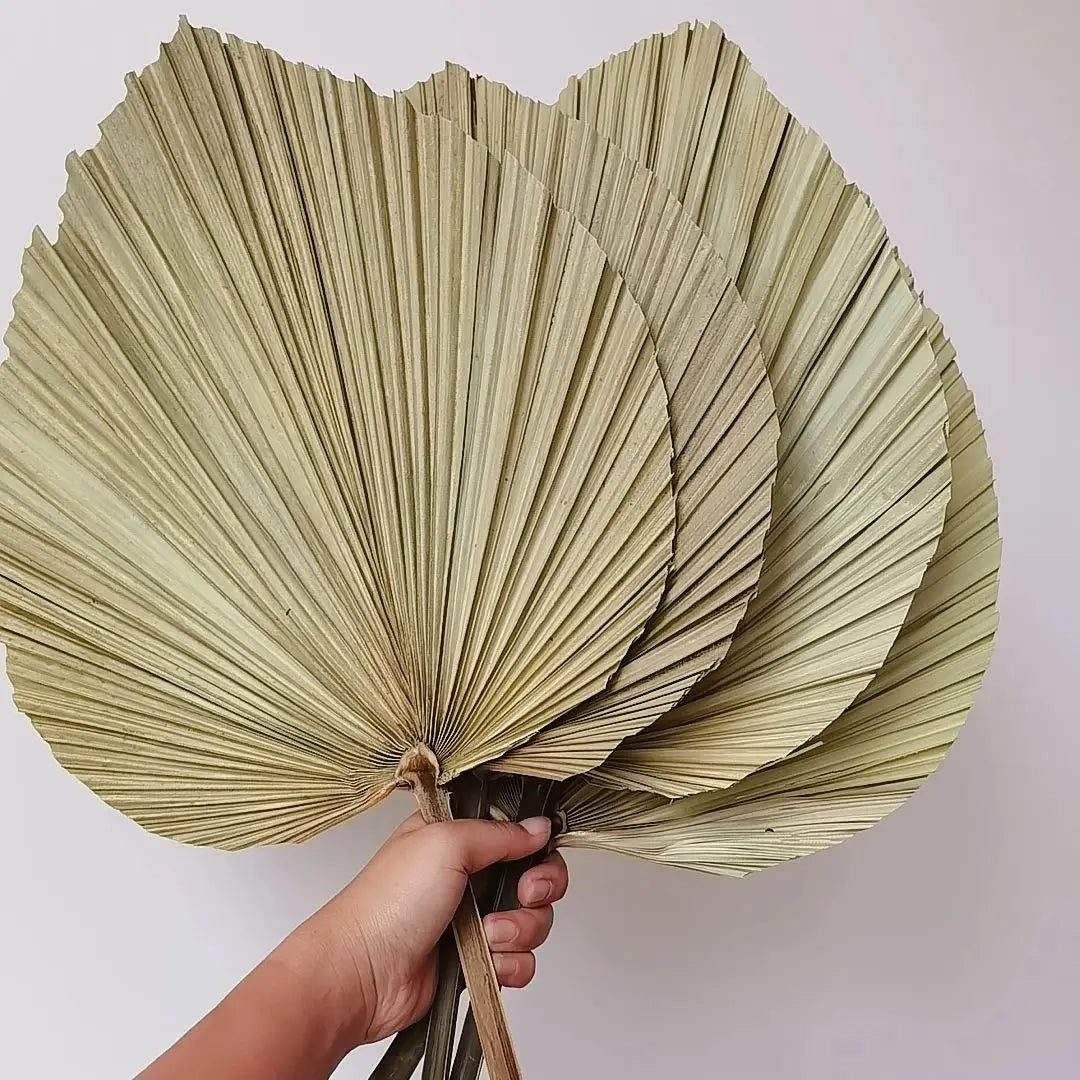 Composition florale feuilles de palmier séchées mariage