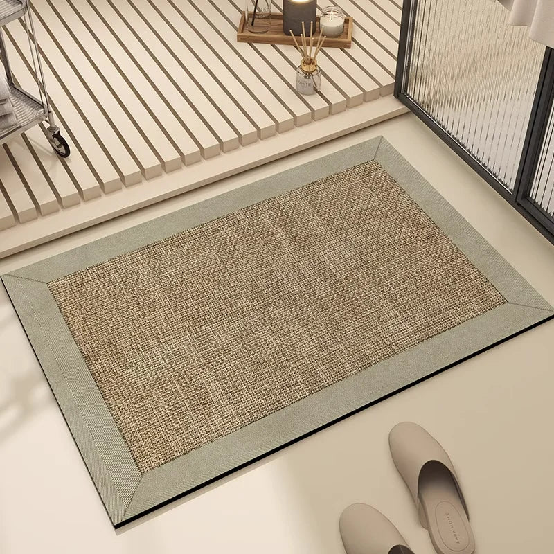 Tapis gris et beige avec un cadre sobre, disposé dans un intérieur moderne avec un plancher clair et des meubles minimalistes.
