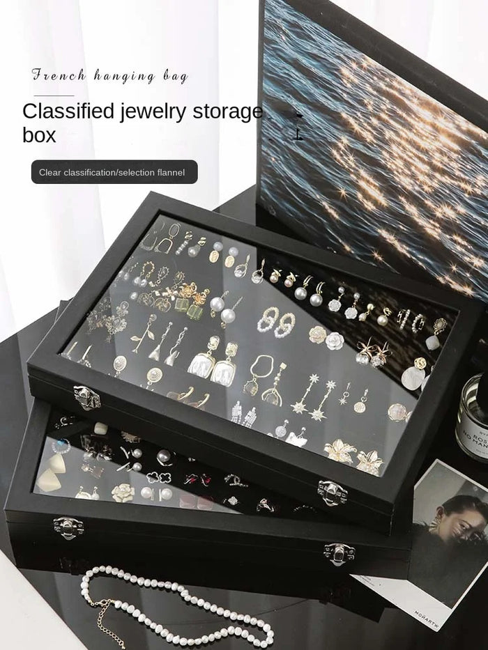 Boîte à bijoux en cuir noir avec couvercle en verre transparent
