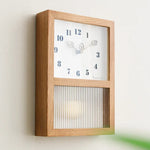 Horloge murale en bois de noyer naturel design feuille minimaliste