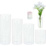 Lot de 4 vases cylindriques en verre transparent sur table