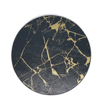 Une surface circulaire noire avec des veines dorées irrégulières, évoquant un motif de marbre.