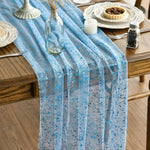 Chemin de table doré avec rubans blancs