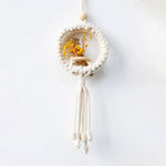 Détail de la fabrication artisanale du macramé en coton naturel