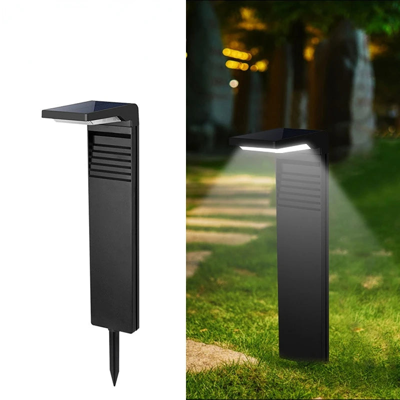 Lampe solaire sur pied avec éclairage blanc chaud dans une pelouse