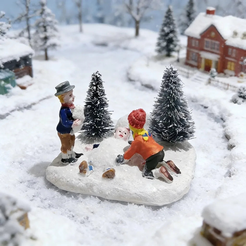 Figurines Village de Noël en résine blanche sur scène hivernale