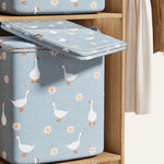 Rangement compact pliable pour optimiser l'espace sous le lit