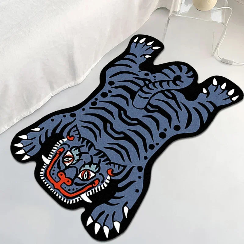 Un motif ornemental abstrait en bleu et noir, évoquant un animal fantastique stylisé avec des formes géométriques dynamiques.