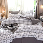 Housse de couette kaki pliée sur fond blanc