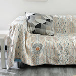 Plaid quatre saisons en coton sur lit