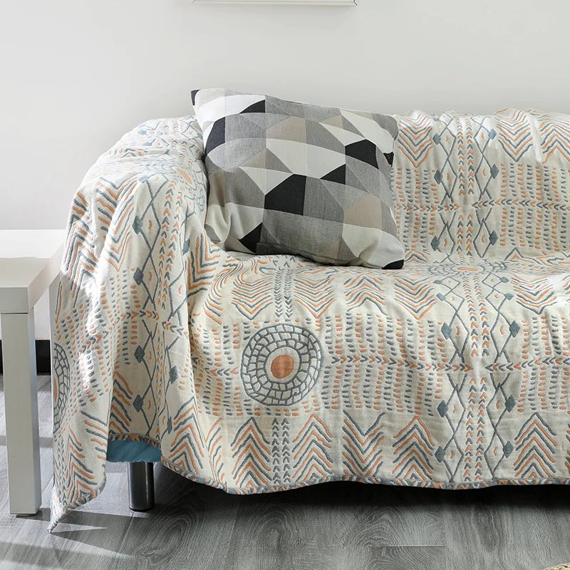 Plaid quatre saisons en coton sur lit