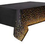 Nappe de décoration à pois noirs bronzants sur une table d'anniversaire