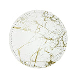 Assiette ronde en marbre blanc et or avec des motifs de veinures dorées, reflet d'un style élégant et épuré.