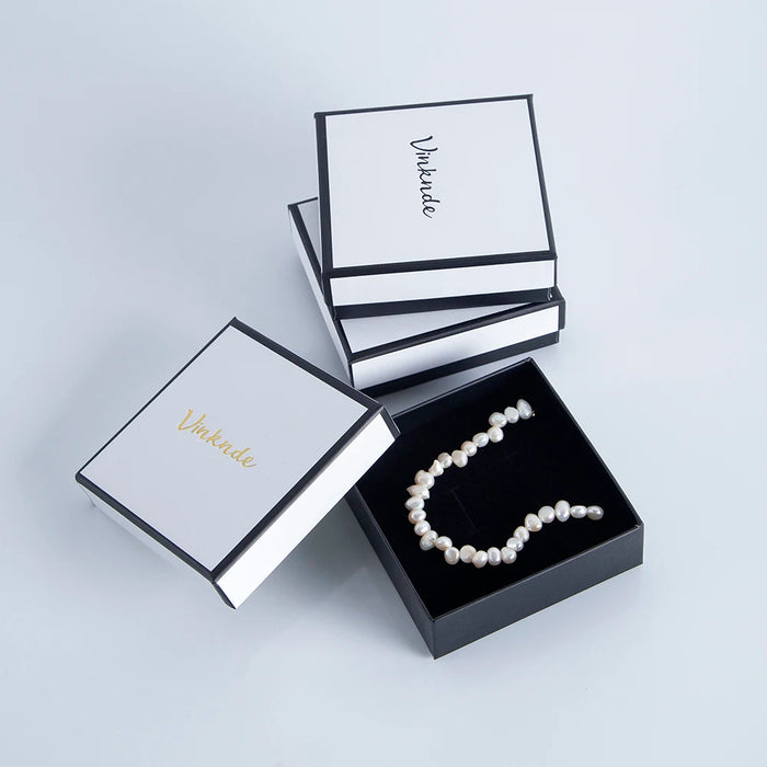 Boîte à bijoux en carton kraft noir et blanc avec mousse noire