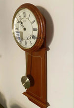 Horloge murale bois massif de côté