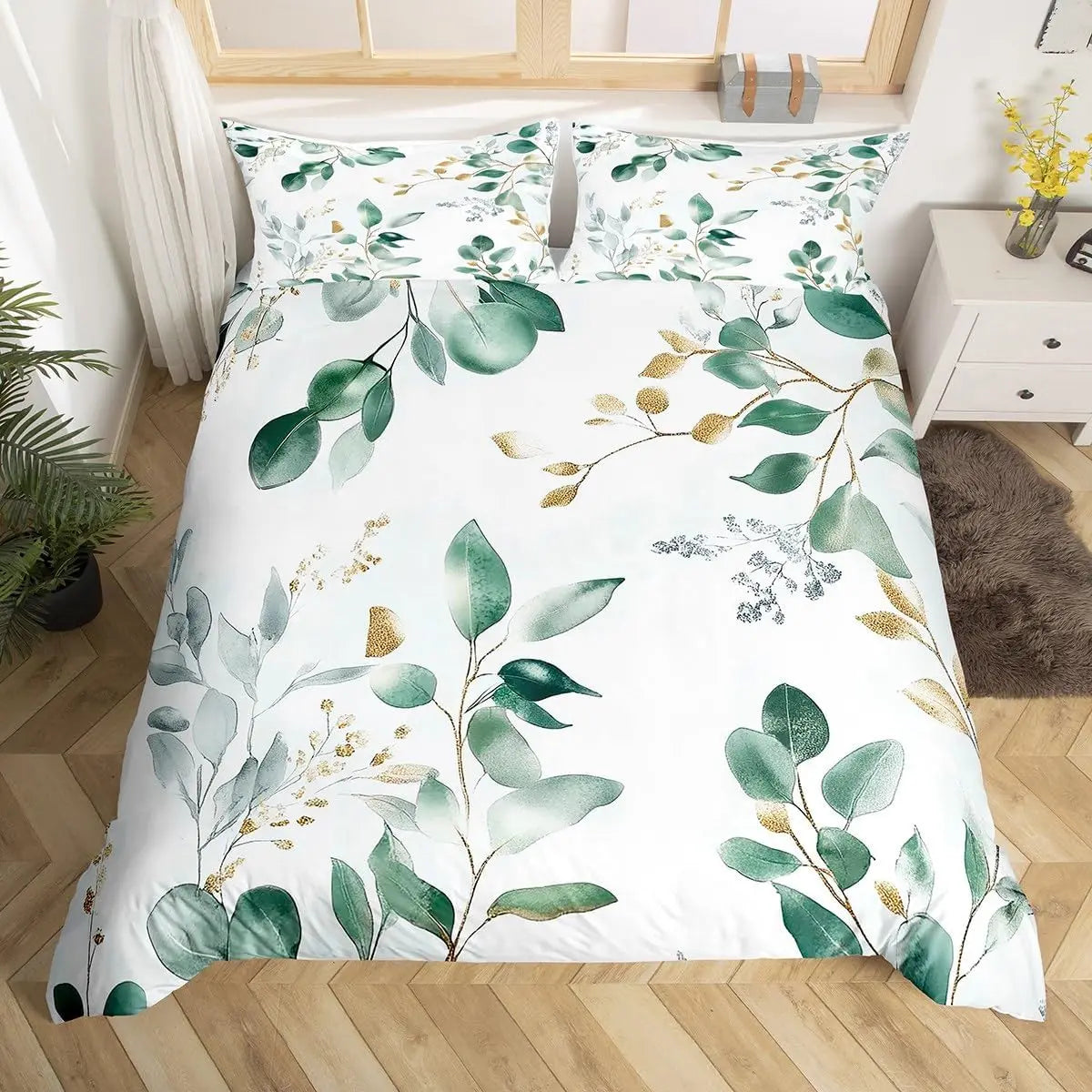 Housse de couette verte sauge imprimée feuilles d'eucalyptus sur un lit