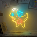 Lampe néon dinosaure mignon allumée en jaune chaud sur bureau enfant