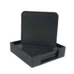 Boîte de rangement pour sous-verres en cuir noir avec motif piqué.
