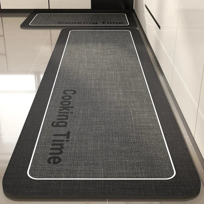 Coussinets de marche texturés en gris anthracite avec des bordures blanches et un logo "Cooking Time" imprimé dessus.