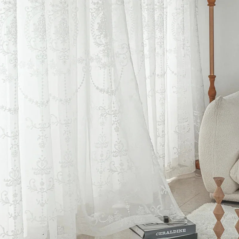 Magnificent white embroidered tulle curtains for an elegant and bright interior