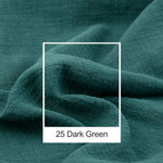 Texture de tissu plissé vert foncé avec un cadre blanc autour de l'image.